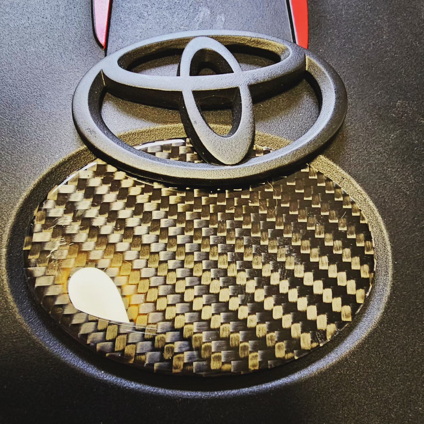 Carbon fiber engine badge