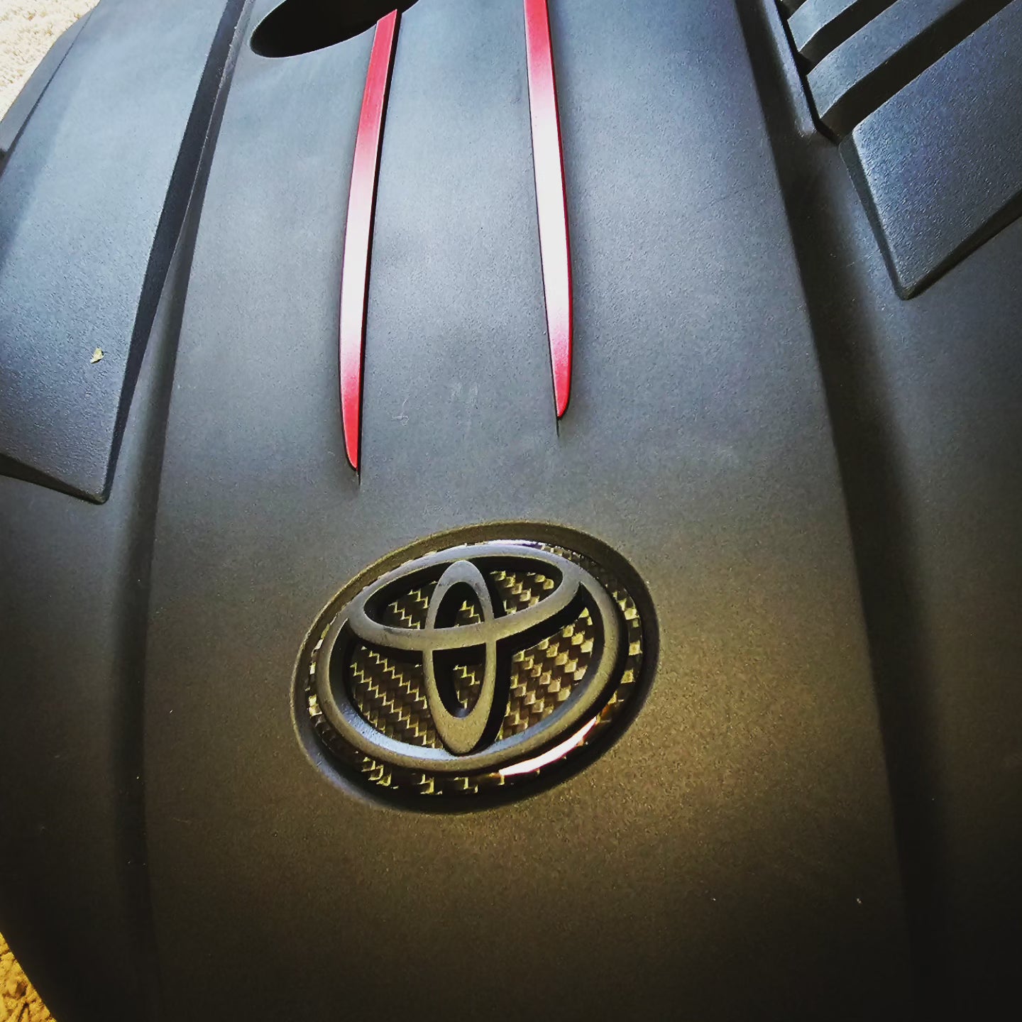 Carbon fiber engine badge
