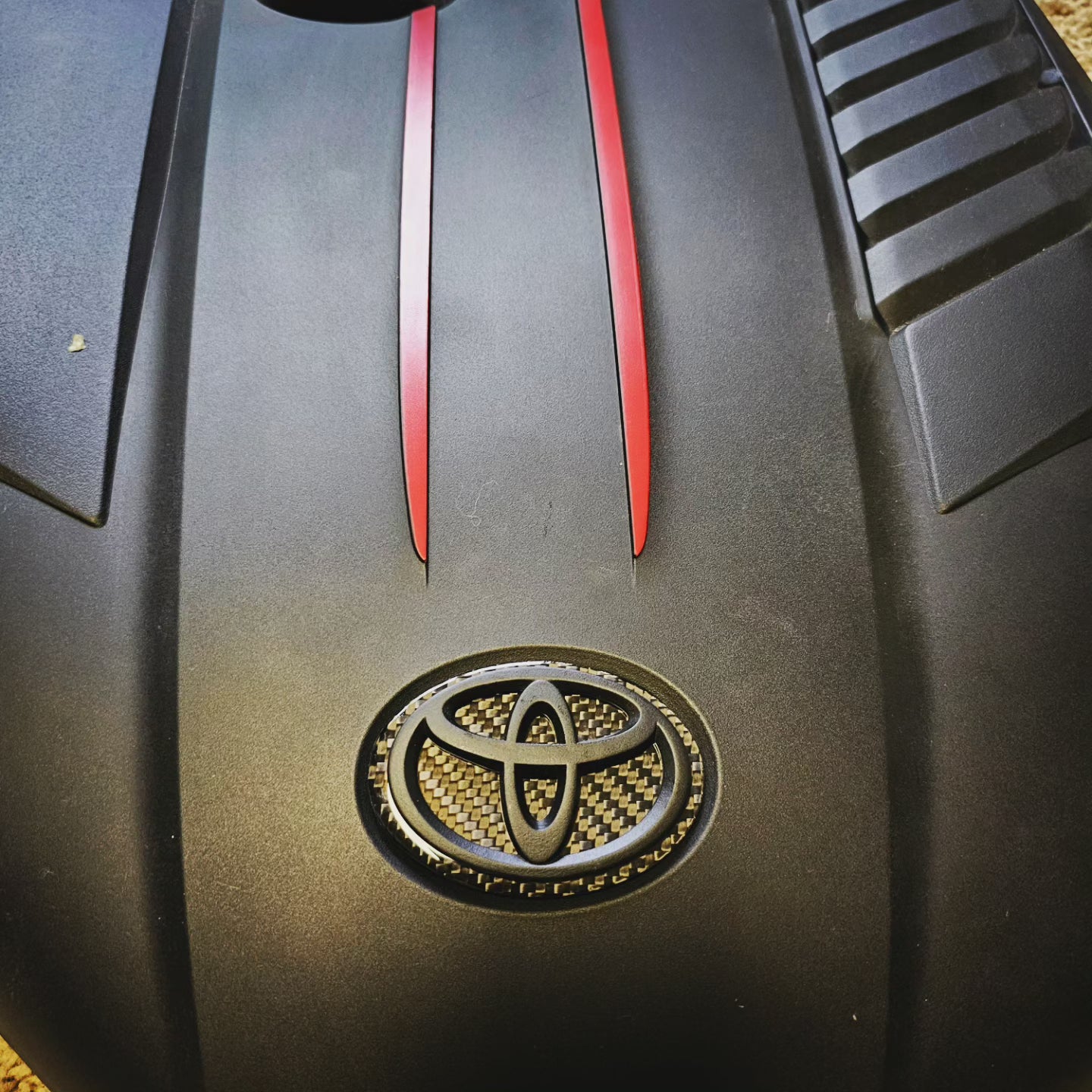 Carbon fiber engine badge