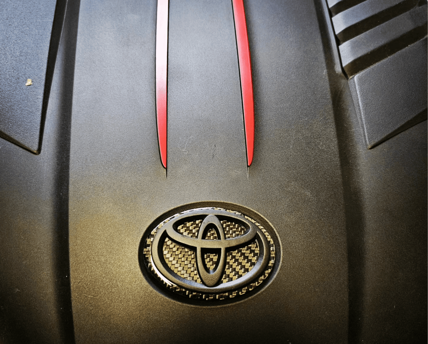 Carbon fiber engine badge