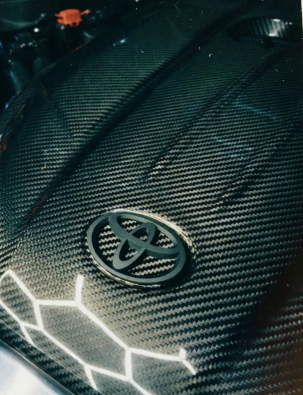 Carbon fiber engine badge